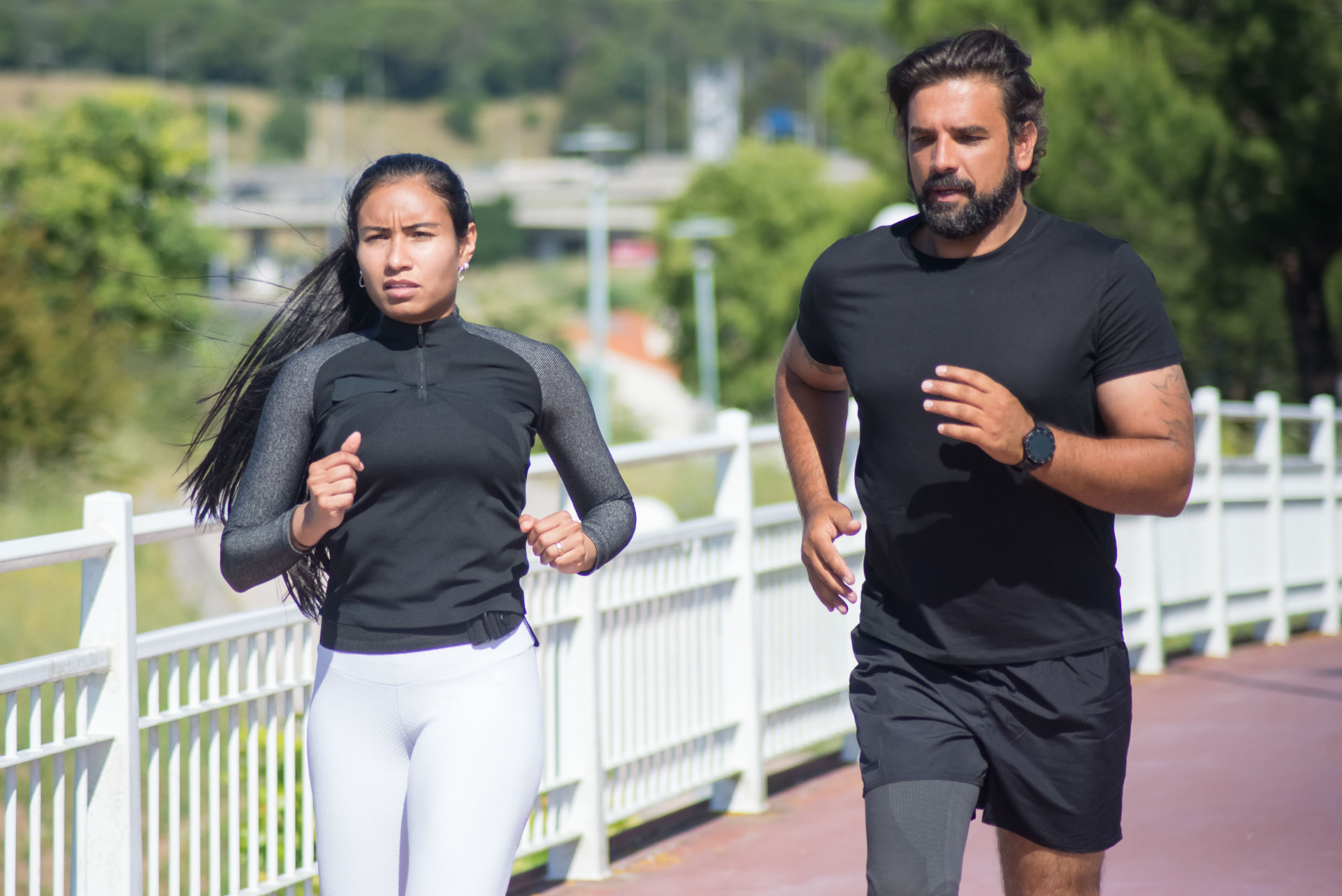Two runners in hot midday light