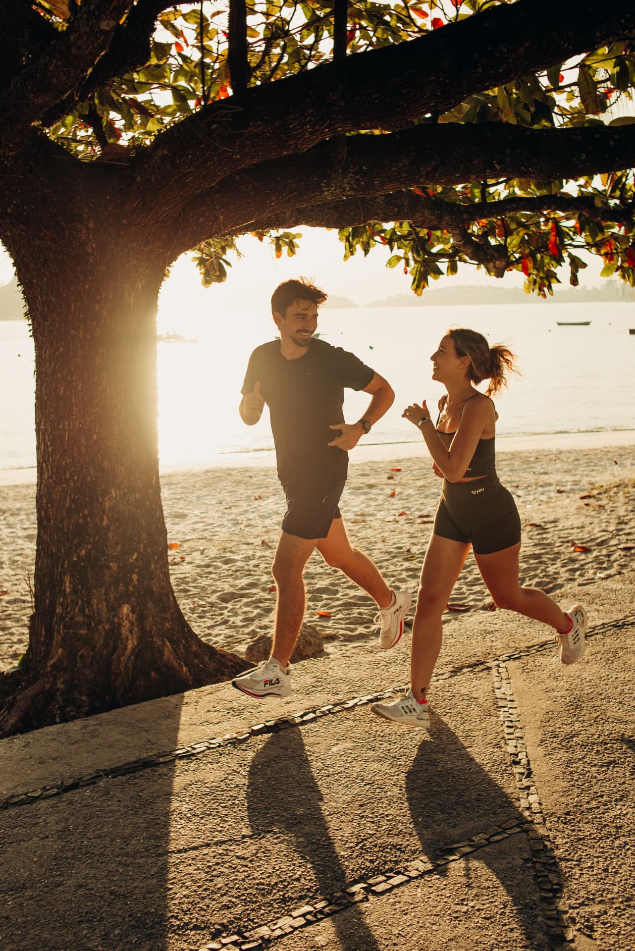 Runners at sunrise in warm hazy light